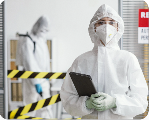 woman-protective-suit-holding-tablet
