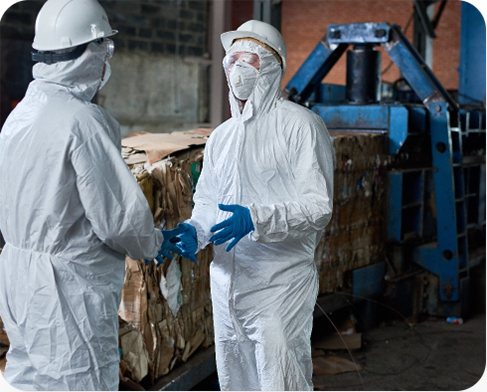 workers-in-hazmat-suits-communicating-at-factory-2025-03-08-08-38-32-utc copy